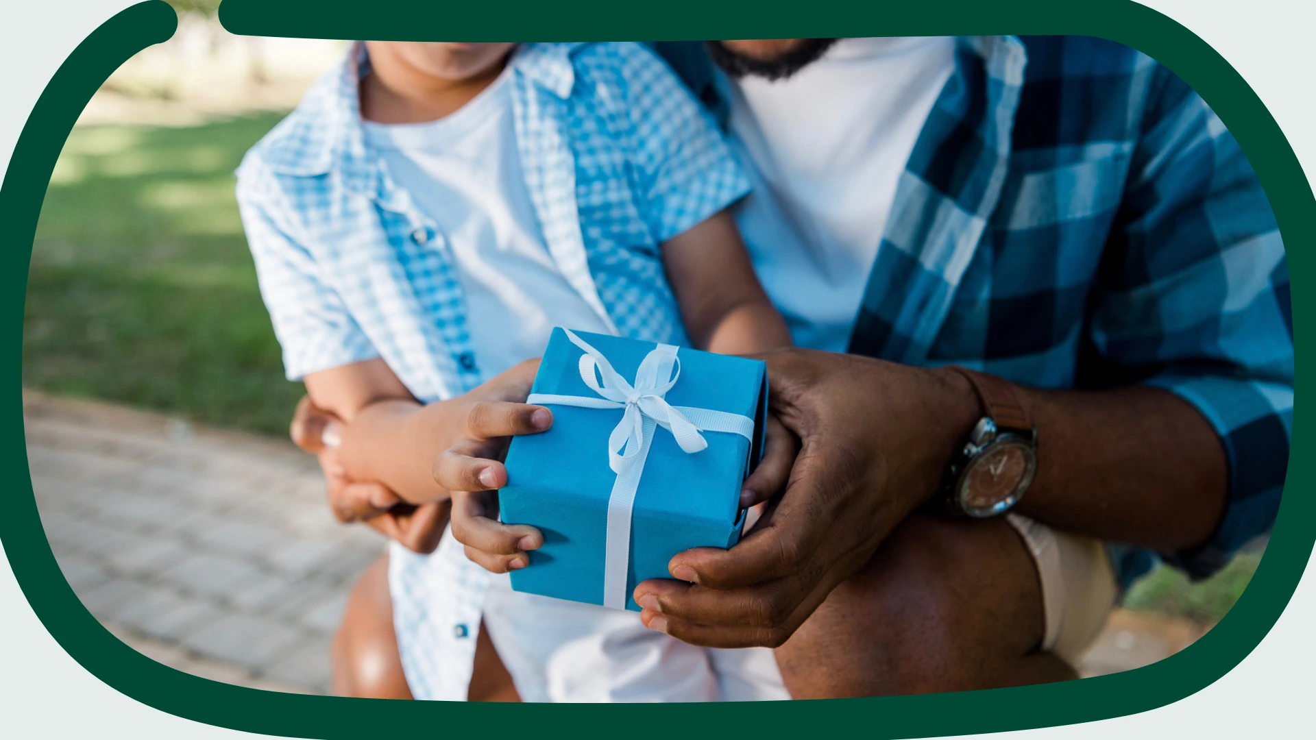 Child handing a gift to a father, illustrating Father's Day marketing ideas for Etsy sellers